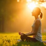 Woman meditating in bright sunlight